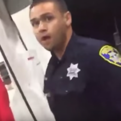 WATCH: Cop Spits on American Citizen in Public, Smirks Afterwards