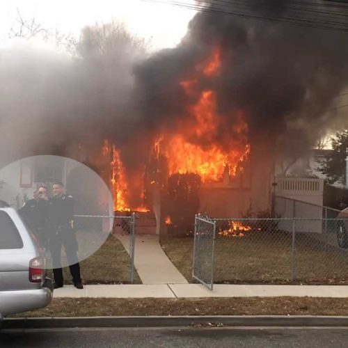 WATCH: Two Long Island Police Officers Caught Taking Selfies in Front of a Burning House