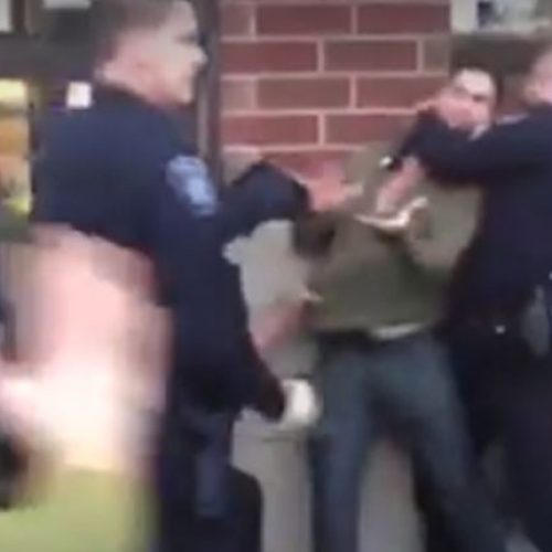 WATCH: Mob of Cops Violently Gang-Tackle and Taser Unresisting Man Outside Michigan Bar